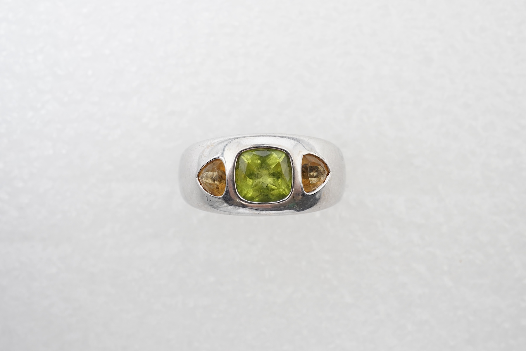 A peridot and citrine dress ring